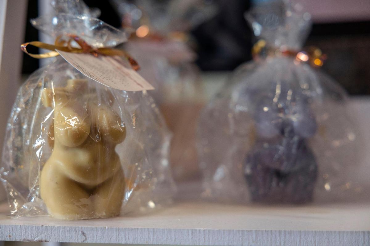 Locally owned R.E.I.N Therapy makes candles specifically for Unleshed+, curvy women’s torsos promoting a positive body image.