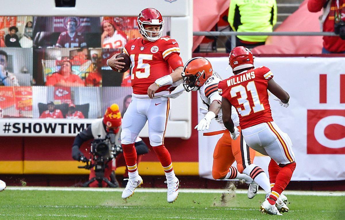 Kansas City Chiefs quarterback Patrick Mahomes spins as he runs in for a touchdown in the first quarter against the Cleveland Browns Sunday, January 17, 2021, at Arrowhead Stadium in Kansas City, Missouri.