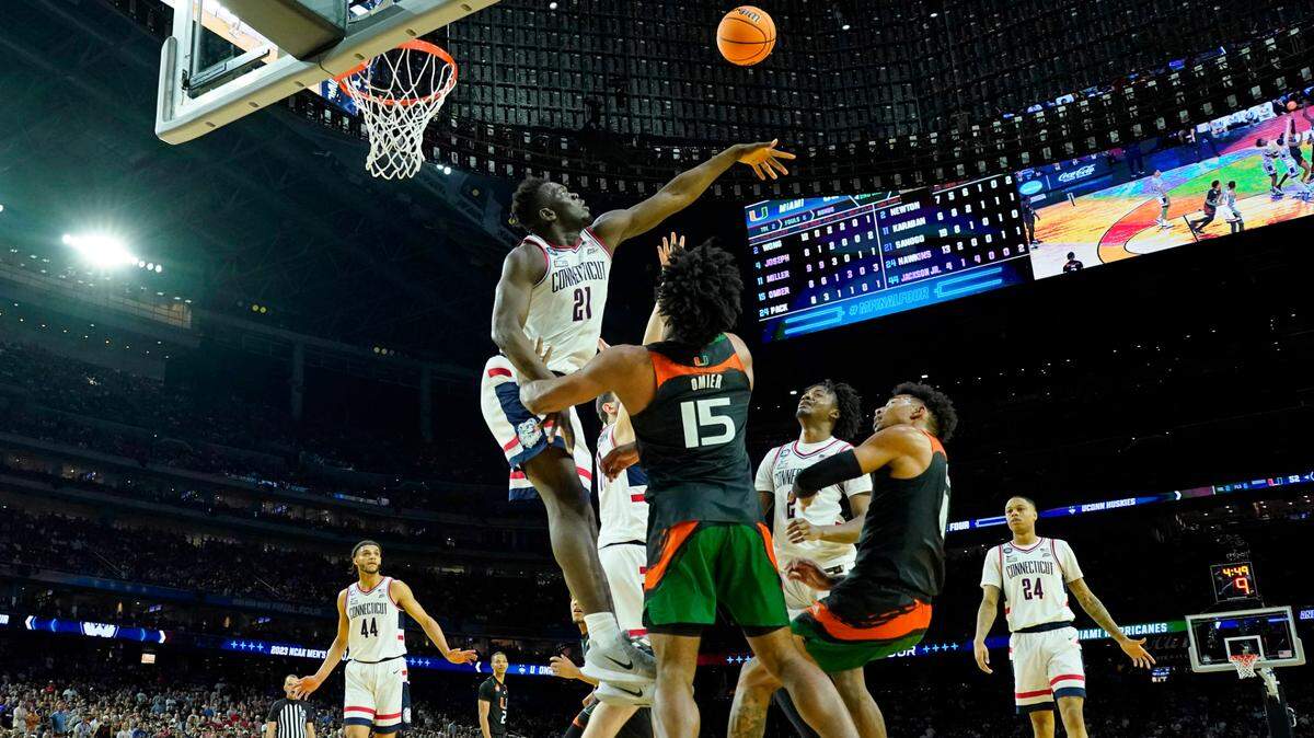 Connecticut forward Adama Sanogo (21) blocks a shot against Miami during the second half of the Final Four of the 2023 NCAA Tournament at NRG Stadium on April 1, 2023.