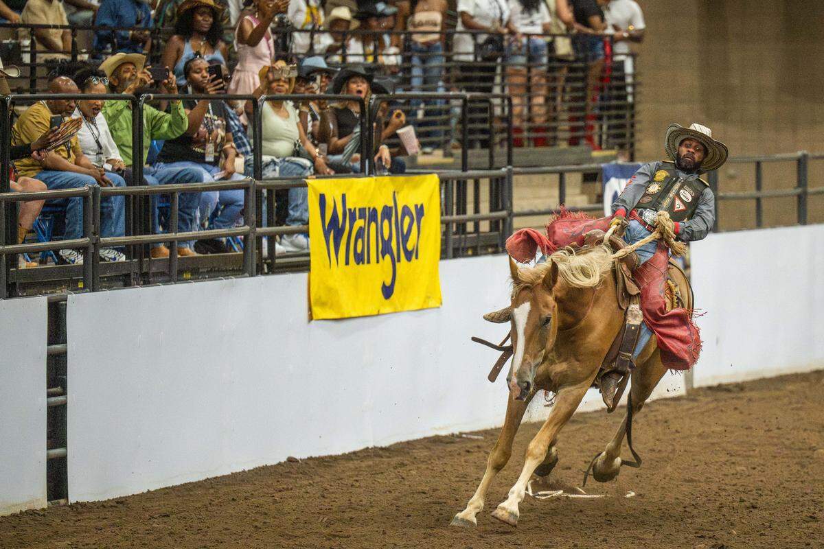 Damon Hopkins participates in the Ranch Bronc competition during the Black Rodeo USA show Saturday at Hale Arena. Hopkins has nearly 50,000 followers on a TikTok account dedicated to showcasing his riding skills.