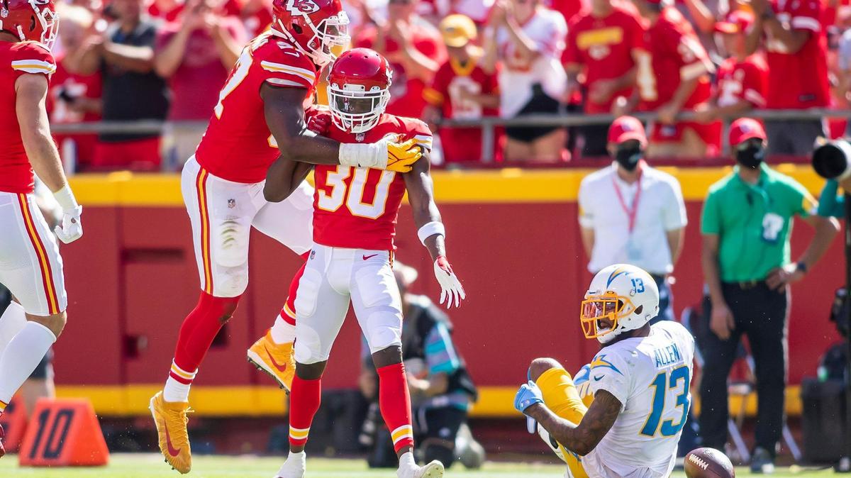 Chiefs cornerback Deandre Baker (No. 30) celebrates with defensive end Alex Okafor after making a defensive stop during a game against the L.A. Chargers.