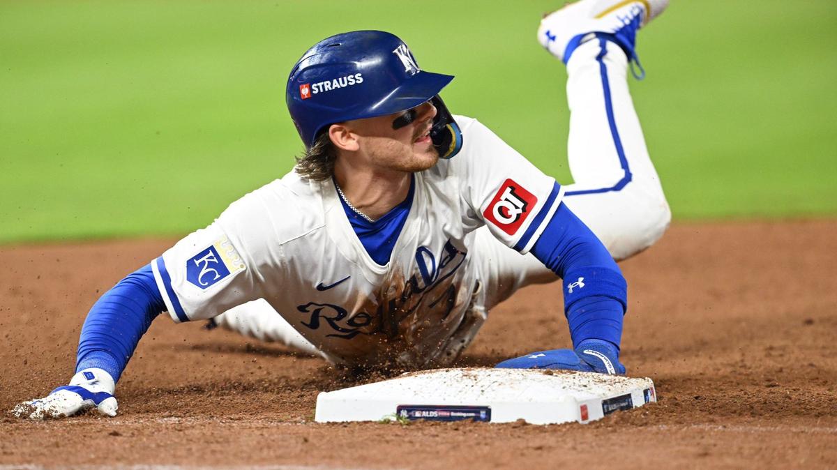 Kansas City Royals shortstop Bobby Witt Jr. (7) had to dive back to first base when first baseman Vinnie Pasquantino lined out to New York Yankees shortstop Anthony Volpe in the eighth inning during Game 3 of the American League Division Series on Wednesday, Oct. 9, 2024, at Kauffman Stadium.