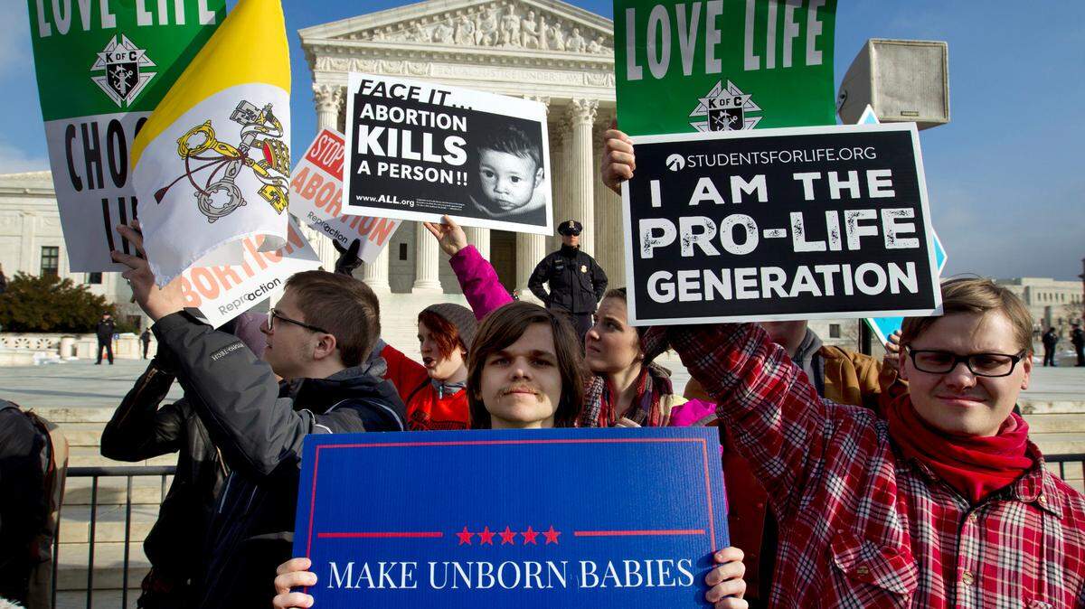 FILE - In this Friday, Jan. 18, 2019, file photo, anti-abortion activists protest outside of the U.S. Supreme Court, during the March for Life in Washington. (AP Photo/Jose Luis Magana, File)