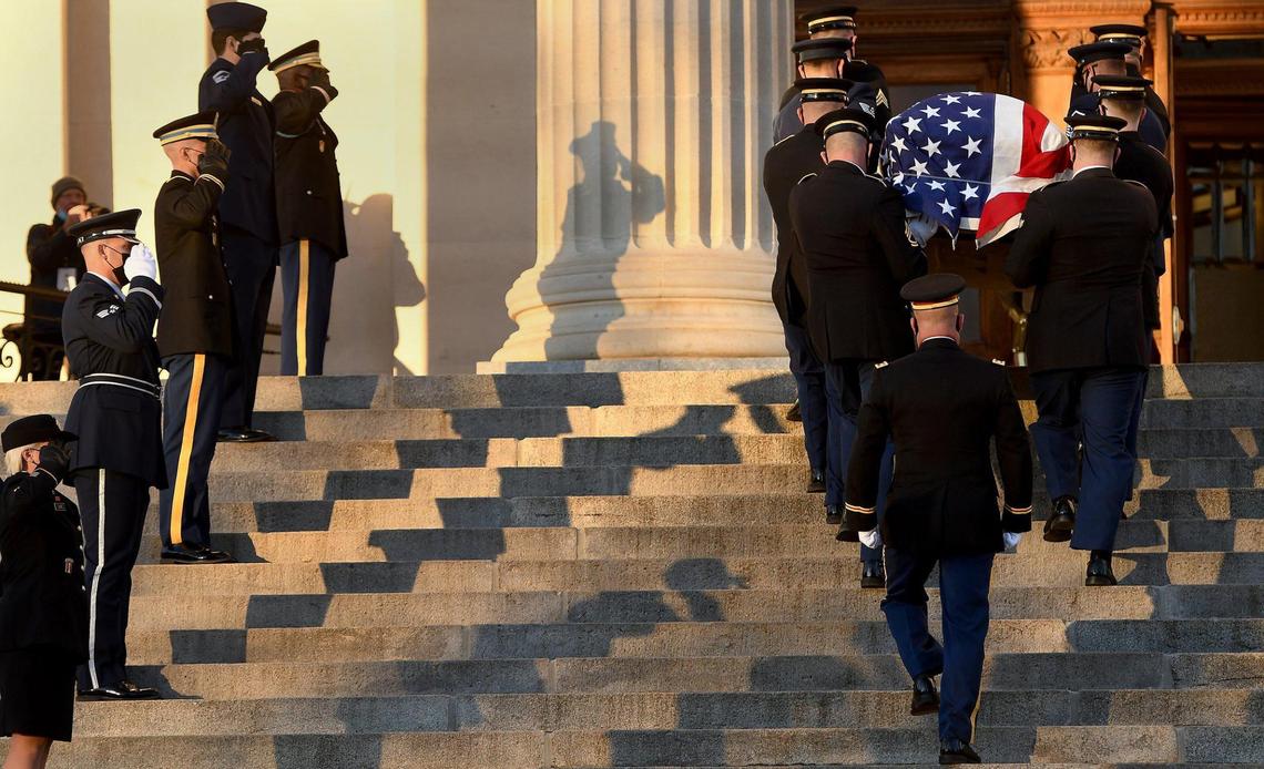 Members of the Kansas National Guard Military Honor Guard carry the casket of Sen. Bob Dole into the Kansas State Capitol building in Topeka for his memorial service Saturday, Dec. 11, 2021. Hundreds paid their respects to Sen. Bob Dole as he lay in repose. Dole battled lung cancer and died in his sleep on Dec. 5 at 98.