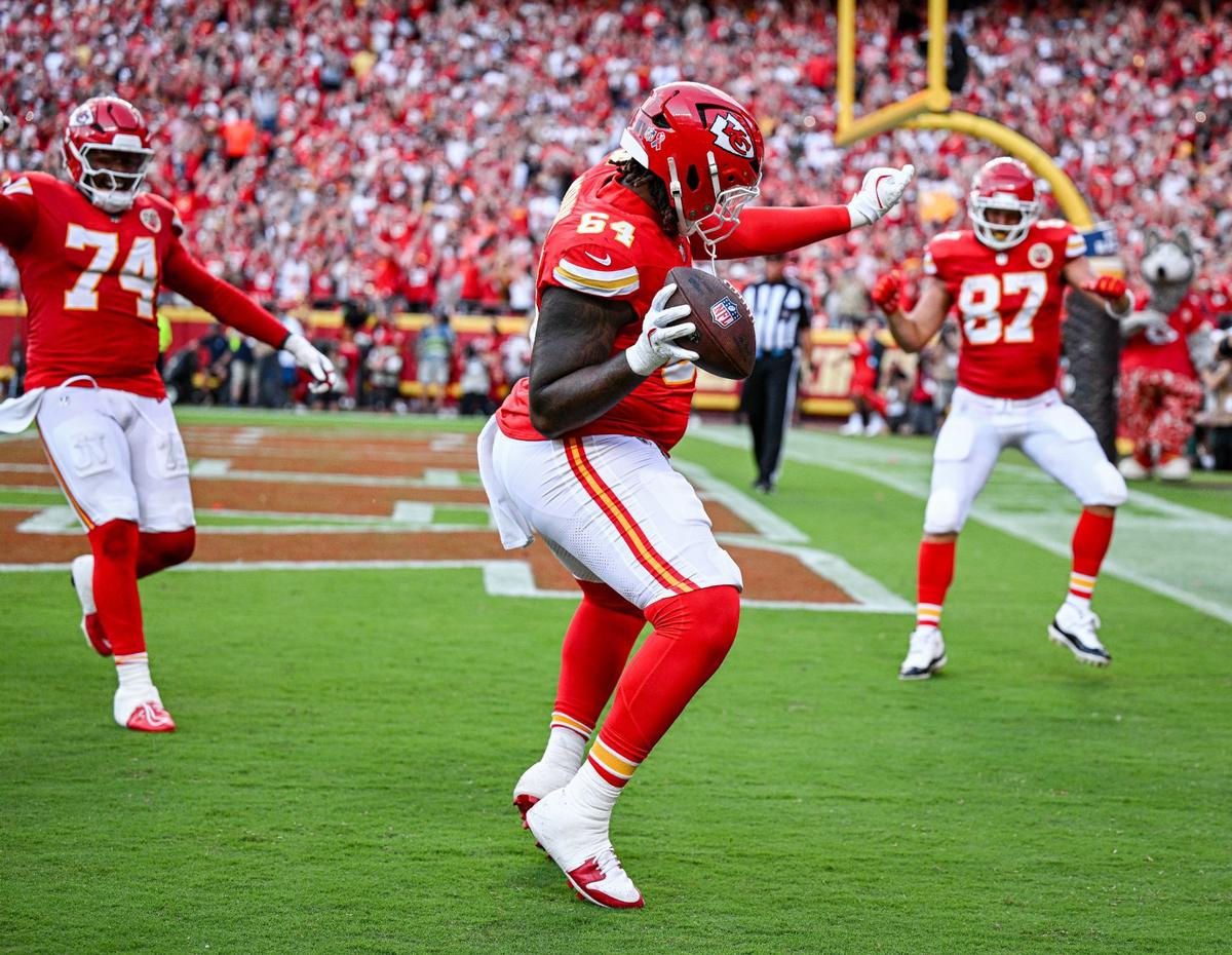 Kansas City Chiefs tackle Wanya Morris (No. 64) dances with teammates Jawaan Taylor (74) and tight end Travis Kelce (87) after pulling down a TD catch Sunday at GEHA Field at Arrowhead Stadium.