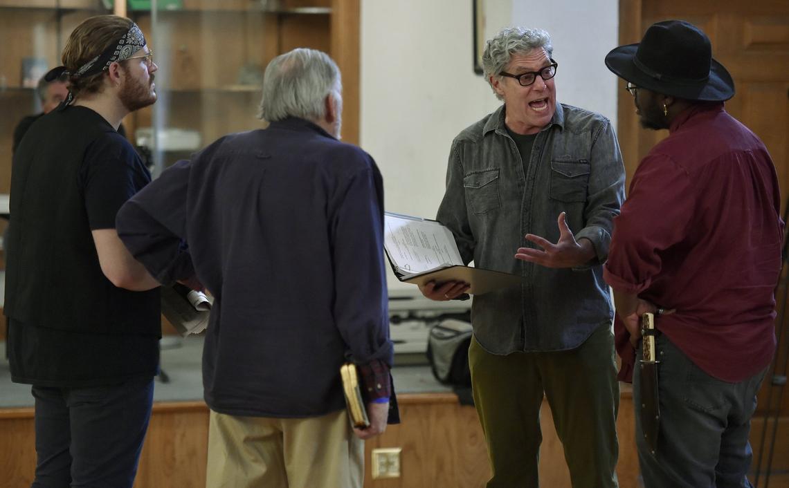 Director John Rensenhouse worked with his cast during a recent rehearsal of “Dracula.”