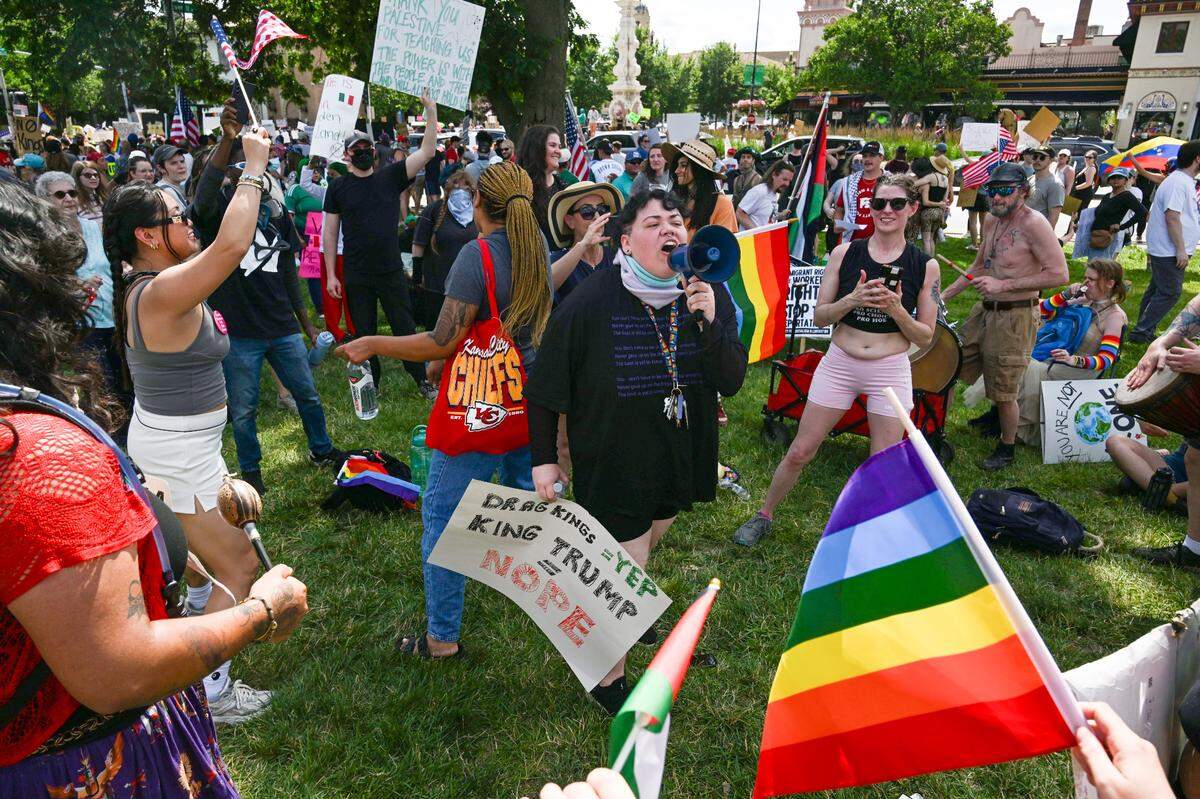 Many groups used the moment to rally for their cause including members of the LGBTQ community at the “No Kings” day of defiance on Saturday, June 14, 2025, at Mill Creek Park in Kansas City.