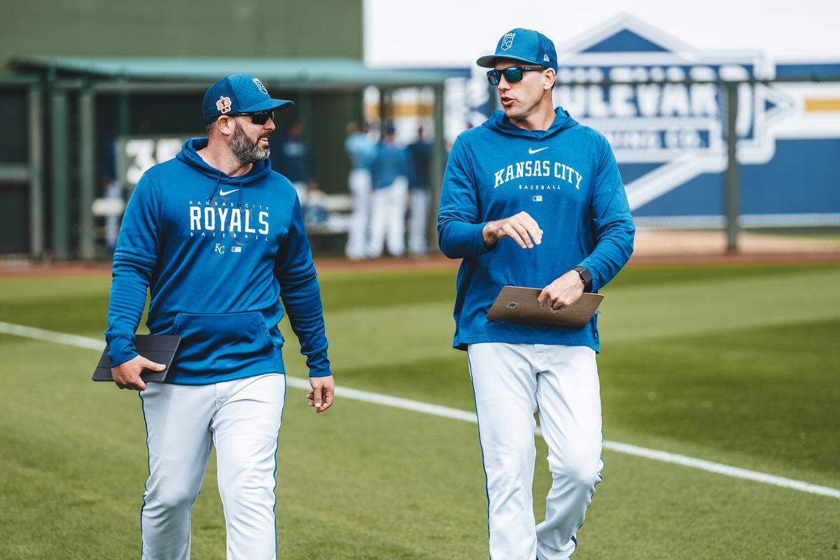 Royals major-league pitching strategist Andy Ferguson, left, chats with assistant pitching coach Zach Bove during their days together on the Royals’ coaching staff.
