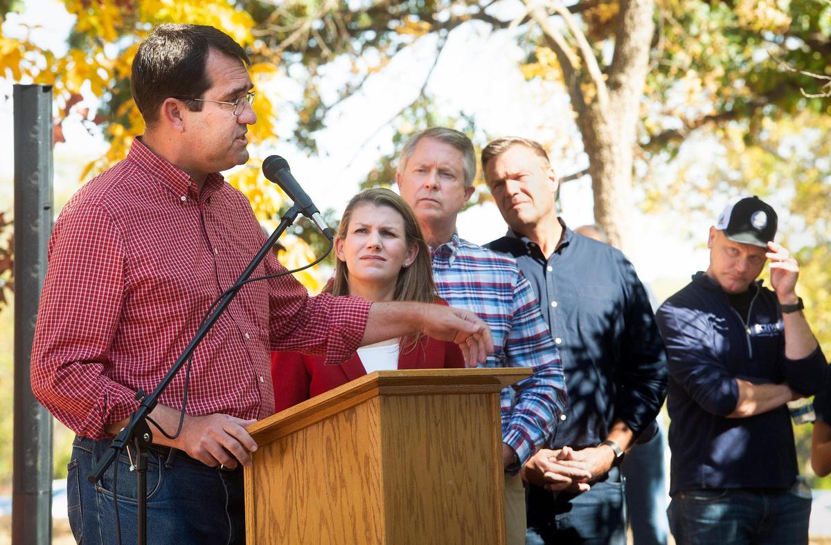 Kansas Attorney General and GOP nominee for governor Derek Schmidt spoke at the podium while, from left, Republican congressional candidate Amanda Adkins, Sen. Roger Marshall, GOP nominee for Kansas attorney general Kris Kobach and Secretary of State Scott Schwab stood by Sunday, October 9, 2022, during a stop on their campaign tour at Shawnee Mission Park.