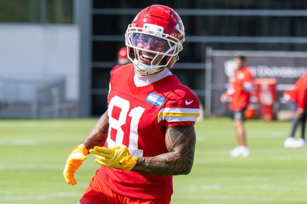 Kansas City Chiefs wide receiver Nikko Remigio (81) smiles between practice drills during Chiefs practice on Friday, Oct. 3, 2025, in Kansas City.