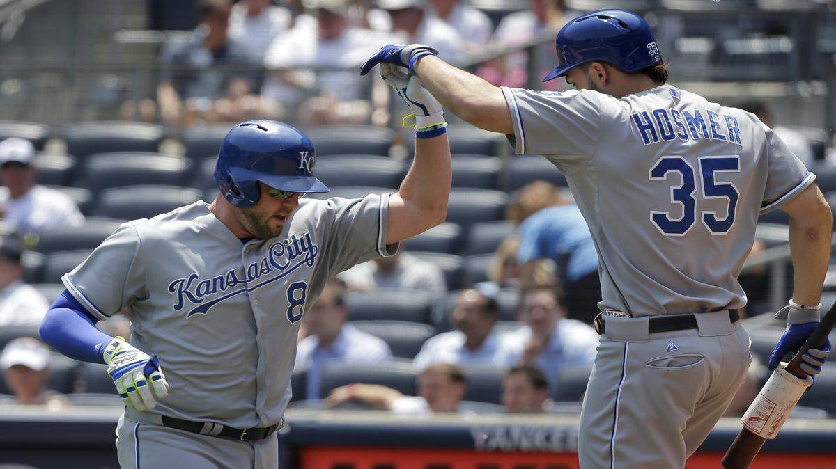 The Royals' Mike Moustakas was greeted by Eric Hosmer after hitting a solo home run against the Yankees in the first inning Wednesday in New York.