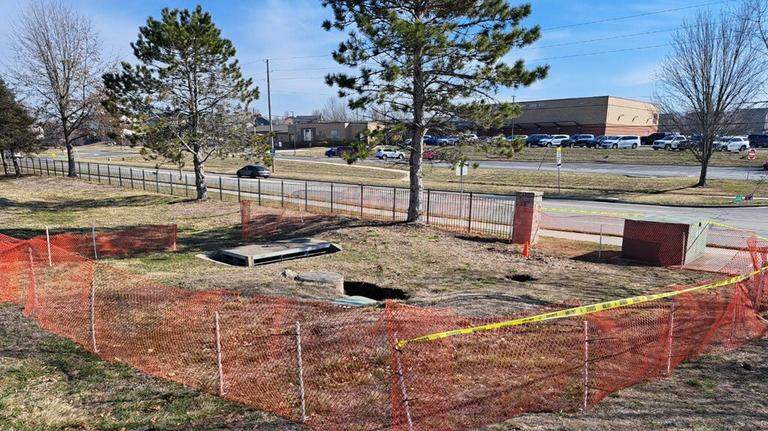 Year after sinkhole, city is set to repair pipes near Johnson County high school