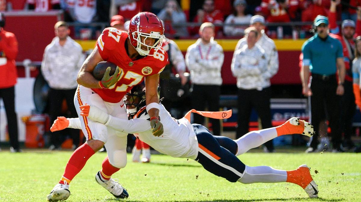 Kansas City Chiefs tight end Travis Kelce (87) gets tackled by the Denver Broncos in the first half on Sunday, Nov. 10, 2024, at GEHA Field at Arrowhead Stadium.