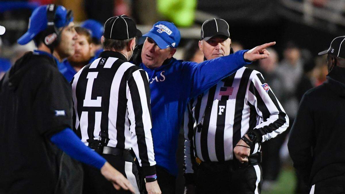 Kansas head coach Lance Leipold argues a call with line judge Scott Reilly against Texas Tech on Saturday, Nov. 12, in Lubbock, Texas.
