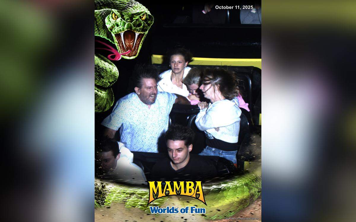 Chris and Cassie Evins, center row, are shown in this ride image they purchased from Worlds of Fun, holding onto a girl whose lap belt came undone during a run of the Mamba roller coaster on Oct. 11, 2025.