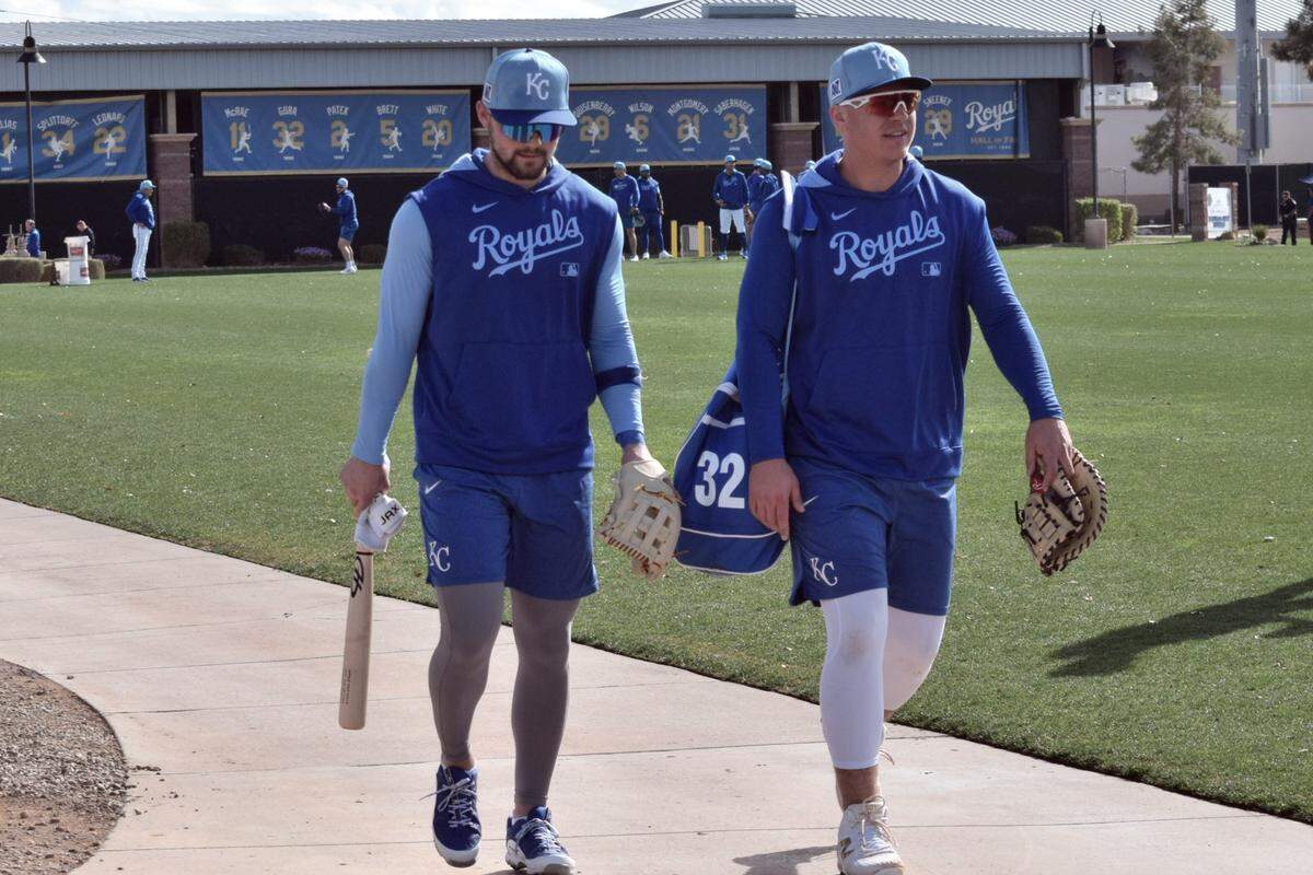 Kansas City Royals Michael Massey (left) and Nick Pratto (right) walk to a morning workout at the club’s spring training complex in Surprise, Arizona.