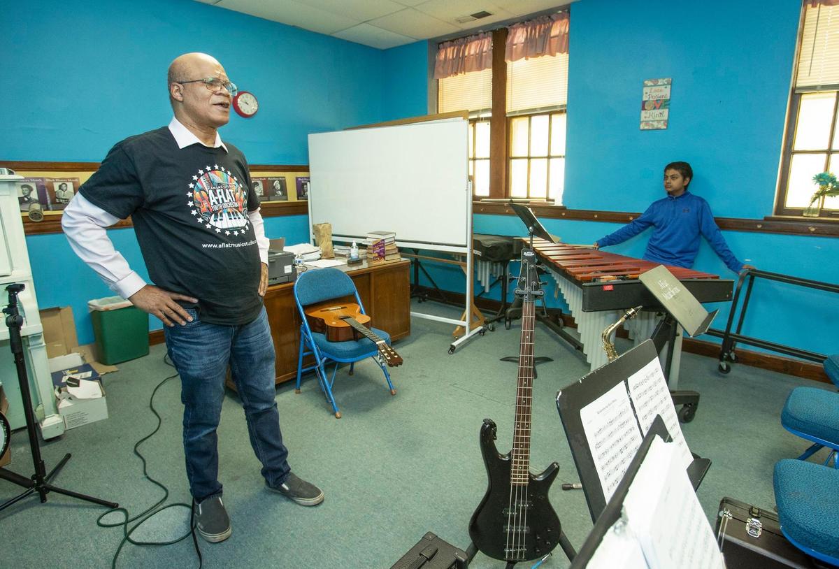 Darryl Chamberlain, founder of the A-Flat Youth Orchestra, led a practice session Saturday, May 31, at Jamison Memorial Temple CME Church in Kansas City.