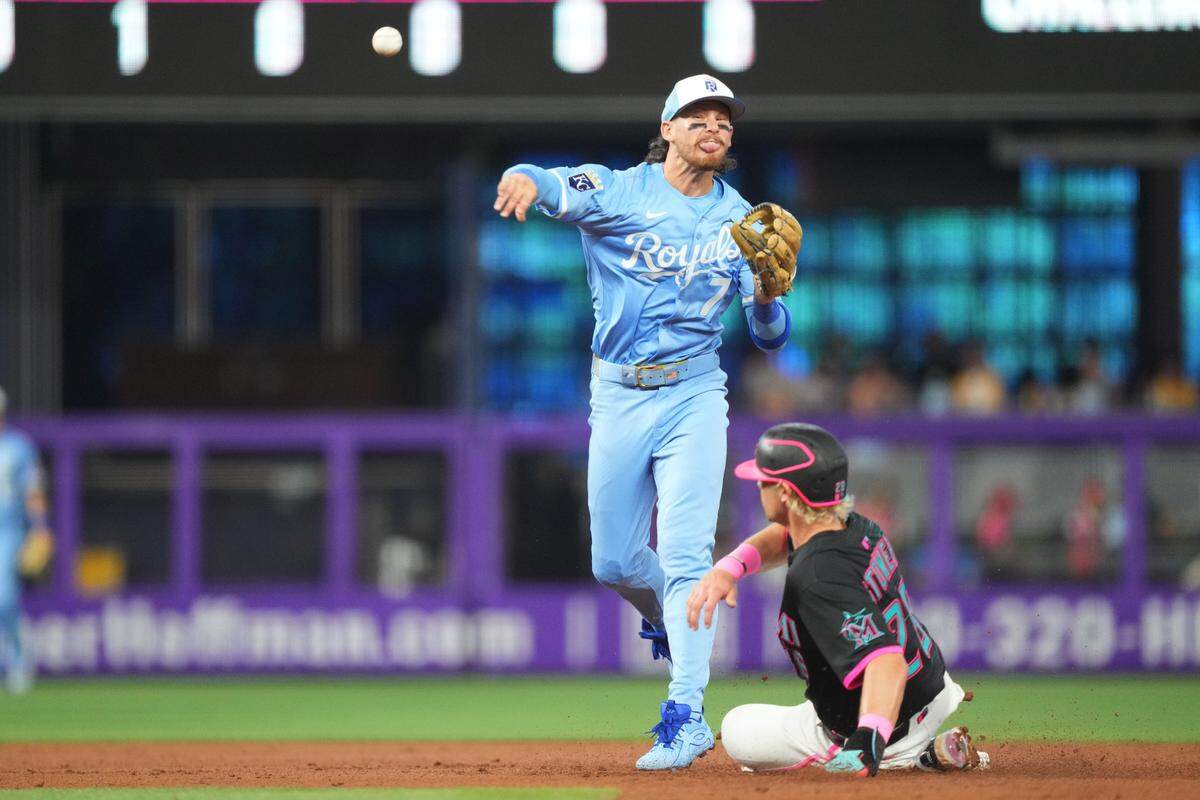 Kansas City Royals shortstop Bobby Witt Jr. turns a double play against the Marlins during a Saturday, July 19, 2025 Major League Baseball game at LoanDepot Park in Miami.