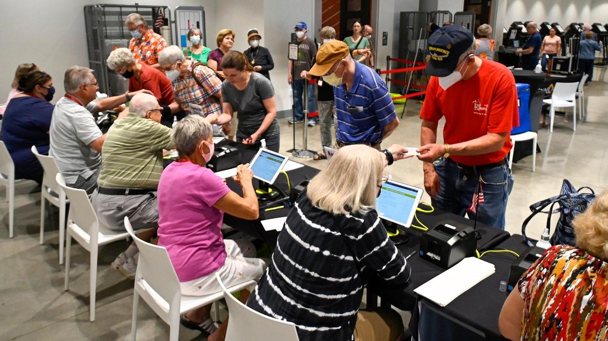 Johnson County residents checked into vote before casting ballots in the 2022 Primary Election on the first day of In Person Advance Voting on Saturday, July 16, 2022, at the Johnson County Arts and Heritage Center in Overland Park.