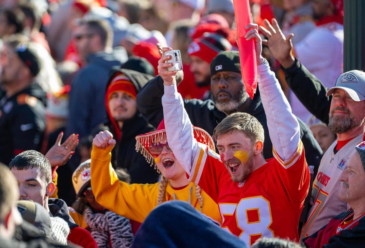 Chiefs fans grooved to music of a DJ before the Super Bowl LVIII championship parade and rally on Wednesday, Feb. 14, 2024, in Kansas City.