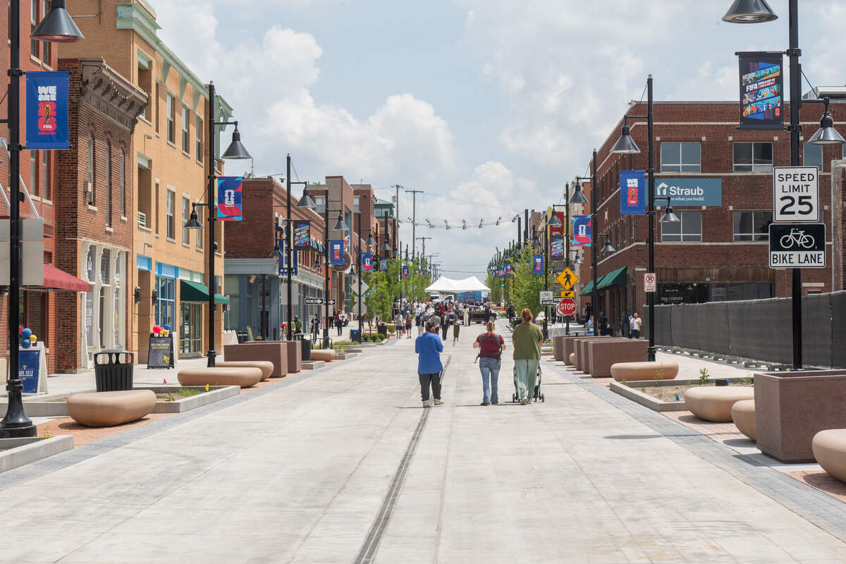 People walk down the newly re-opened pedestrian mall in the 18th & Vine Jazz District on May 27 in Kansas City.