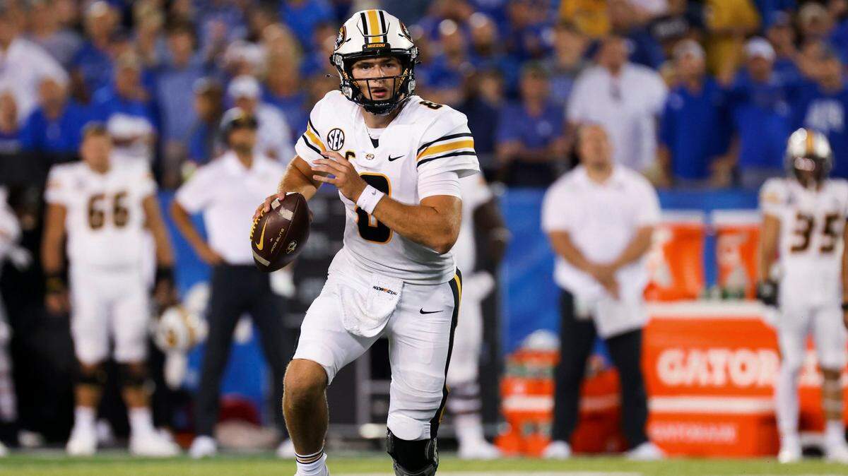 Missouri quarterback Connor Bazelak (8) looks for an open receiver during the second half of an NCAA college football game against Kentucky in Lexington, Ky., Saturday, Sept. 11, 2021. (AP Photo/Michael Clubb)