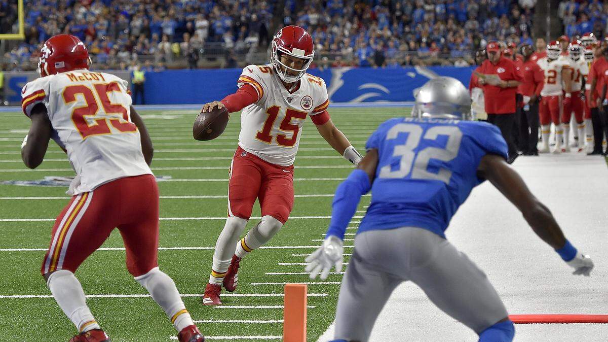 Chiefs quarterback Patrick Mahomes extends the ball for extra yardage during last weekend’s game at Detroit.