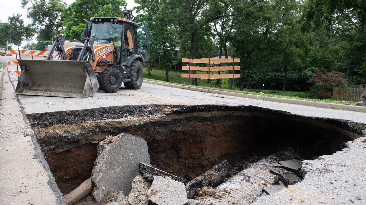 A sinkhole that opened up under Knox Street in Merriam closed the roadway between Johnson Drive and Hocker Drive Friday.