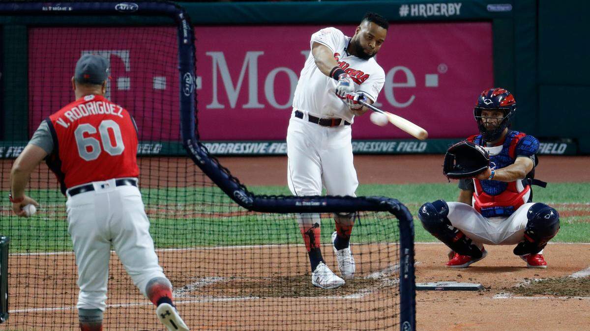 Carlos Santana, of the Cleveland Indians, hits during the Major League Baseball Home Run Derby, Monday, July 8, 2019, in Cleveland. The MLB baseball All-Star Game will be played Tuesday. (AP Photo/Ron Schwane)