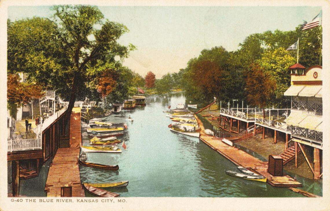 Postcard showing docks, businesses, and watercraft on the Blue River near 15th Street in 1912.