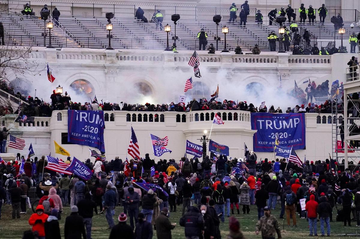 Violent protesters, loyal to President Donald Trump, storm the Capitol, Wednesday, Jan. 6, 2021, in Washington. It’s been a stunning day as a number of lawmakers and then the mob of protesters tried to overturn America’s presidential election, undercut the nation’s democracy and keep Democrat Joe Biden from replacing Trump in the White House. (AP Photo/John Minchillo)