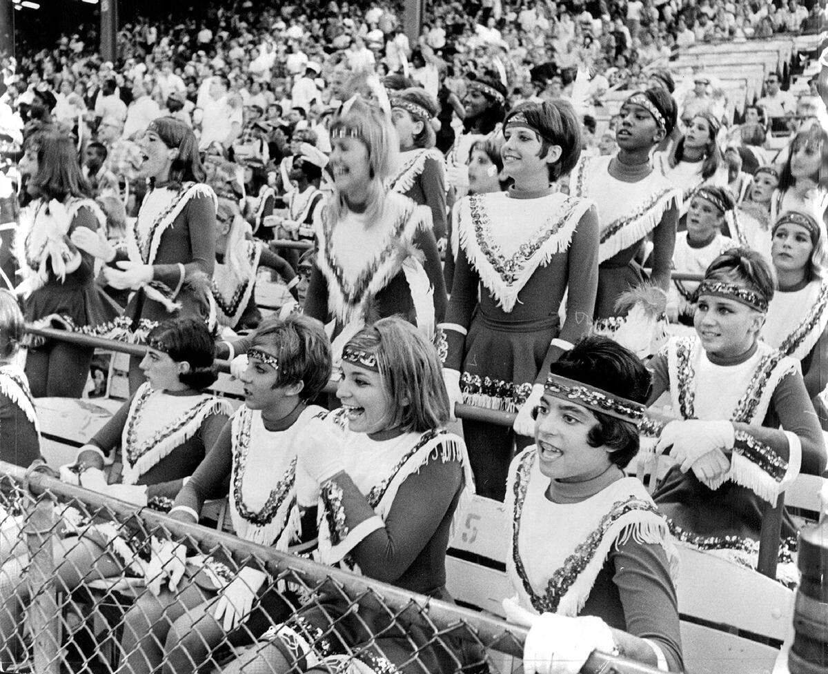 The Chiefettes drill team cheers for the home team from the stands of Municipal Stadium in 1967.