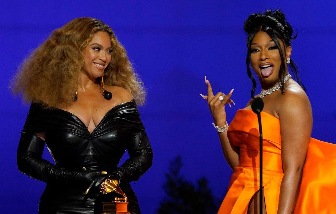 Beyonce, left, and Megan Thee Stallion accept the award for best rap song for “Savage” at the 63rd annual Grammy Awards at the Los Angeles Convention Center on Sunday, March 14, 2021. (AP Photo/Chris Pizzello)