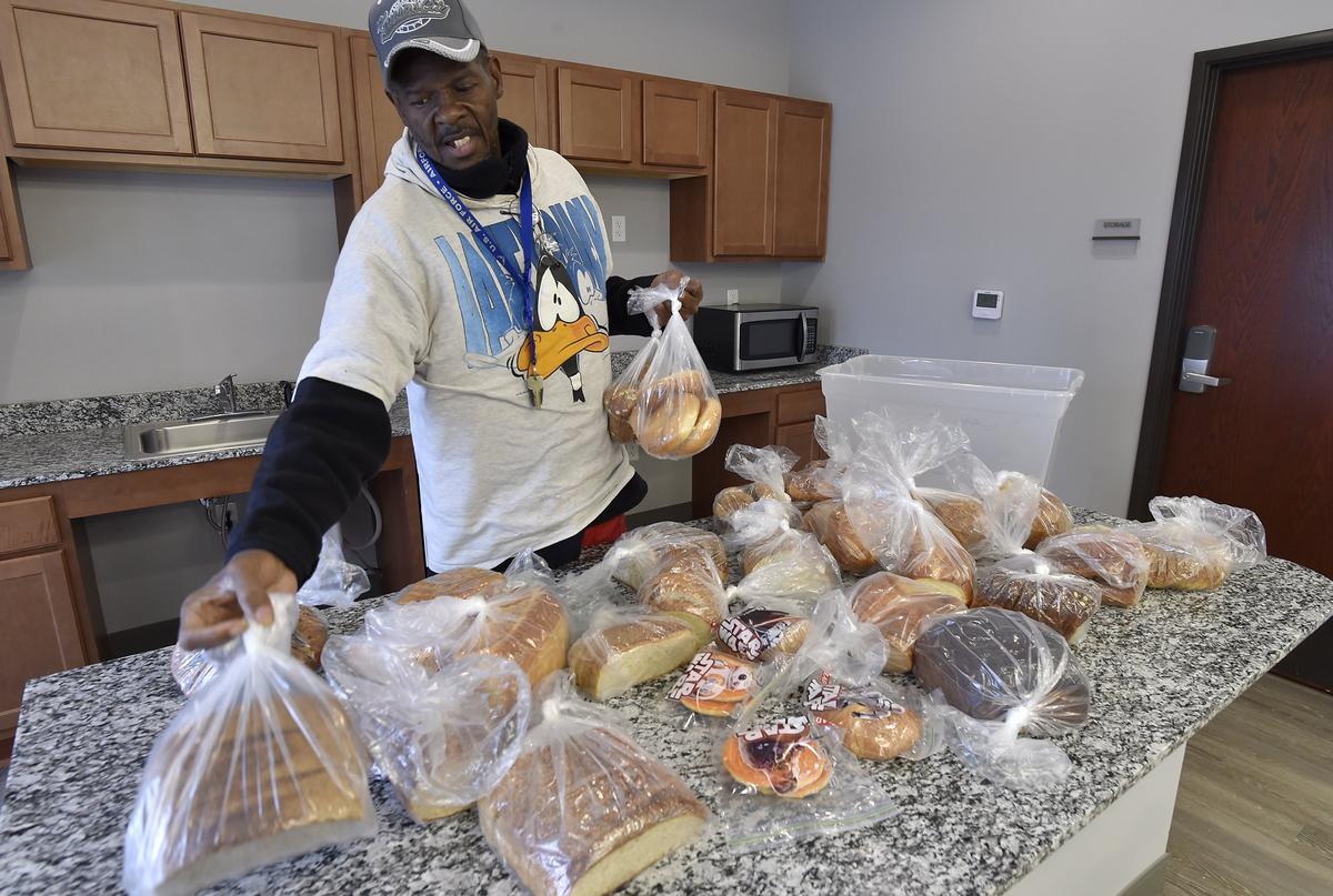 Oliver Allen Jr., an Air Force veteran from the Vietnam era, calls St. Michael’s Veterans Center a “beautiful place.” He recently lent a hand sorting bakery items donated by a local restaurant.