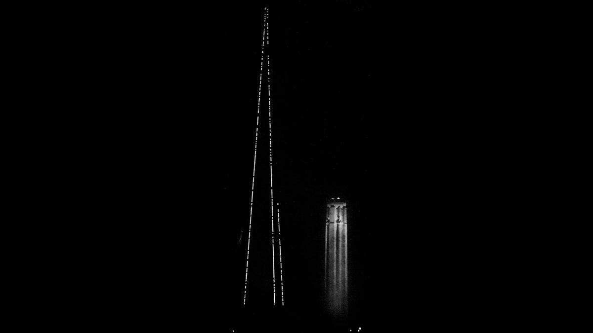 The KCTV tower glowing in the night with the Liberty Memorial tower in the background in 1979.