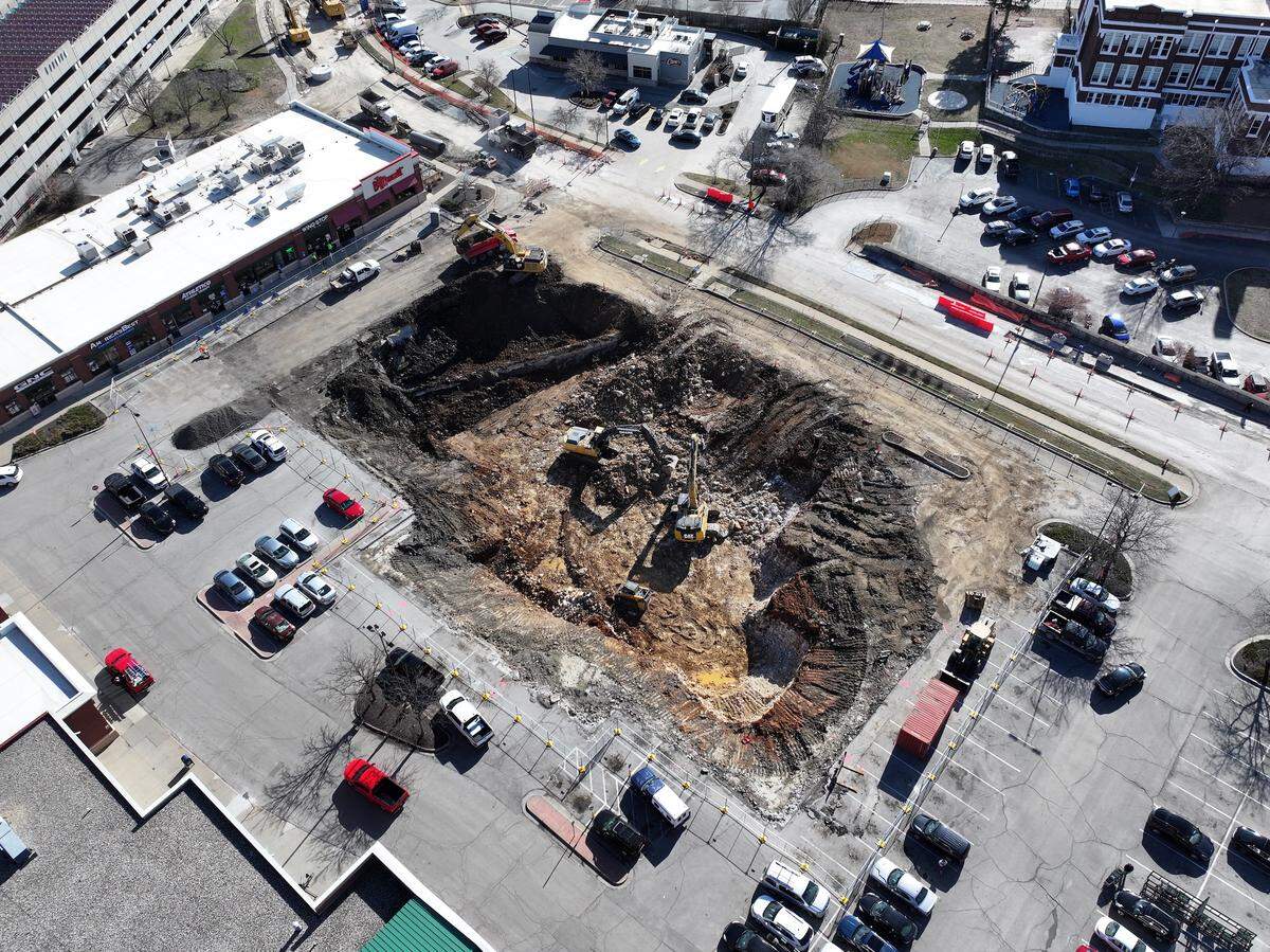 An aerial view shows the excavation in the parking lot of the Westport Sun Fresh