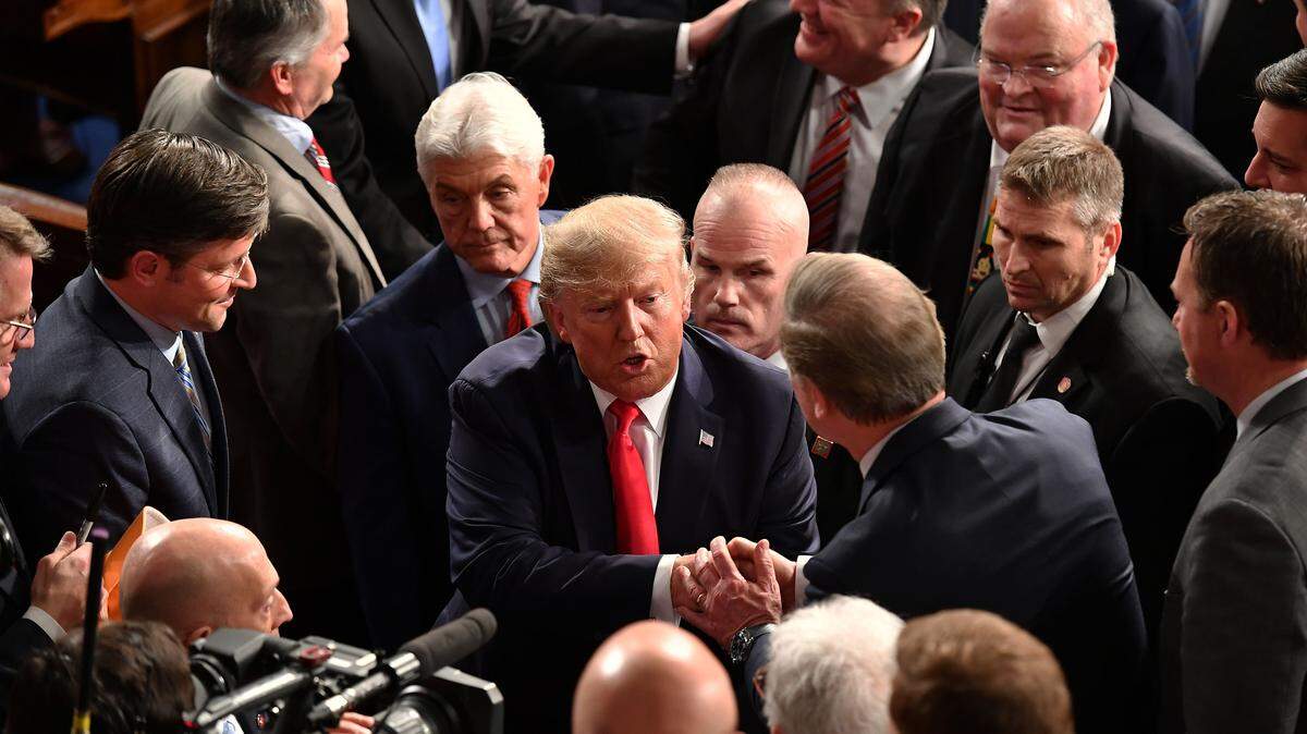 President Donald Trump is greeted after delivering the State of the Union address on Feb. 4, 2020.