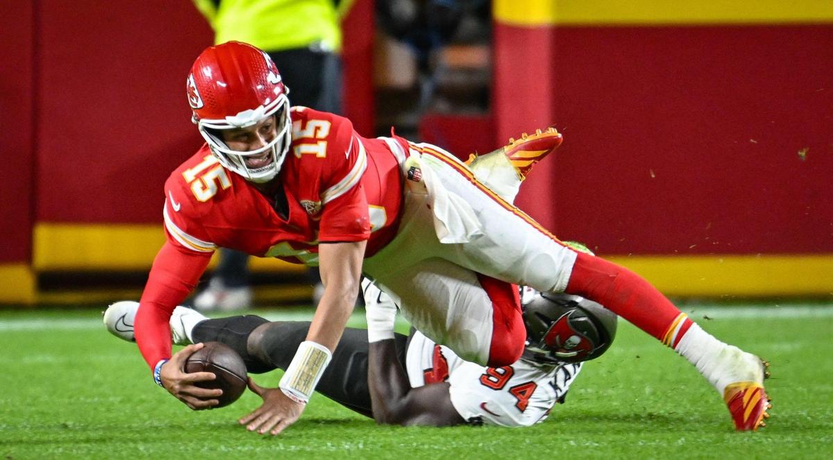 Kansas City Chiefs quarterback Patrick Mahomes (15) is sacked by Tampa Bay Buccaneers defensive tackle Calijah Kancey (94) in the third quarter on Monday, Nov. 4, 2024, at GEHA Field at Arrowhead Stadium.