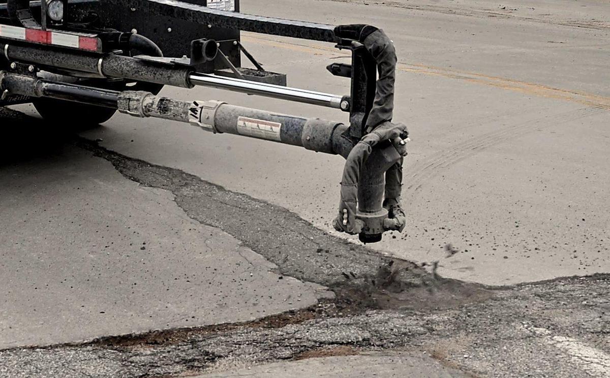 After blasting out all debris from a pothole with highly compressed air, this spray pothole patching vehicle, now being used by the Kansas City, Kansas Public Works Department, sprays a hot asphalt mix into the hole and then covers it with crushed rock. The work is completed by one person, who operates the machine from the vehicle’s cab. In some cases, the new vehicle can patch potholes in as little as two minutes. KCK Public Works is having a contest to name the newfangled machine. To vote, visit wycokck.org/NameThePatcher or dial 3-1-1. Voting will close on July 1.