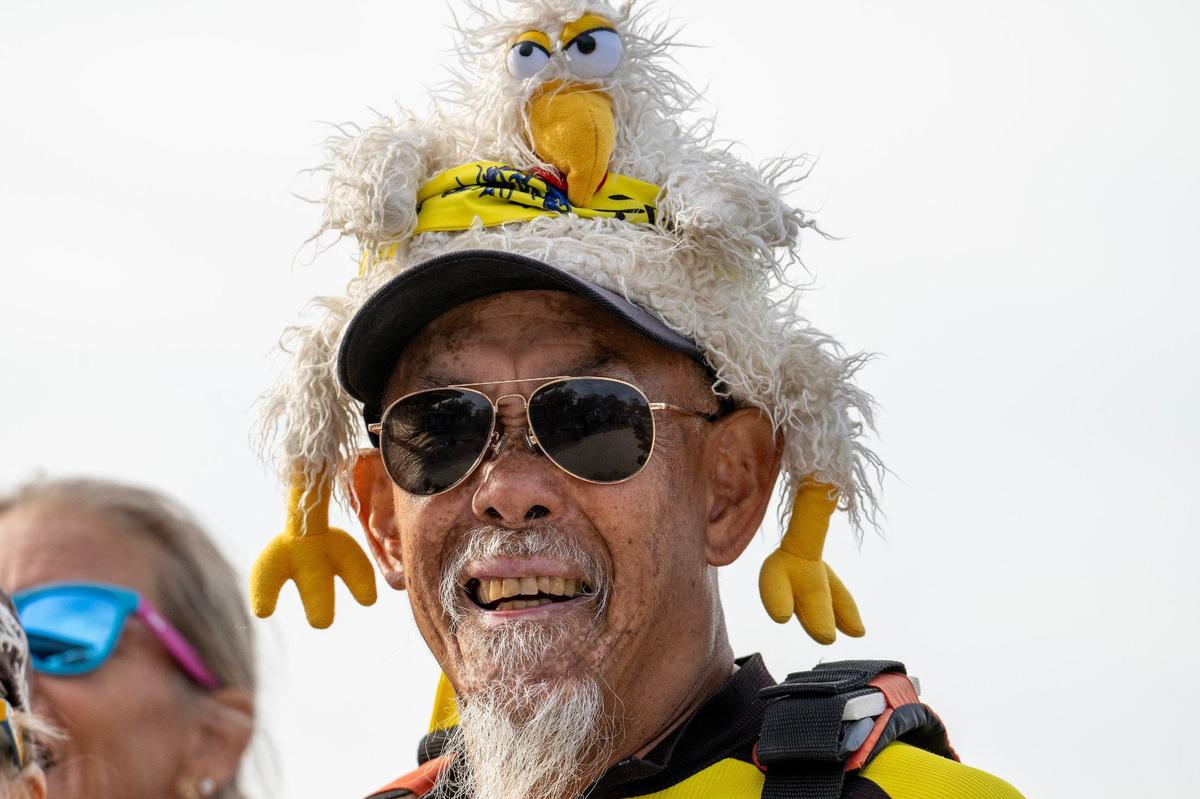 Drummer for Phantom Dragons, Tom Hidebater, wears a chicken-themed hat during the KC Dragon Boat Festival on Saturday, Sept. 28, 2024, at Shawnee Mission Park.