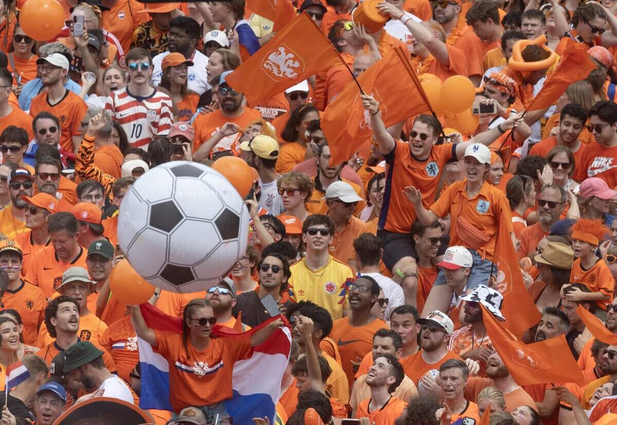 Netherlands soccer fans party at the intersection of Grand and Pershing in downtown Kansas City on Thursday, June 25, 2026.