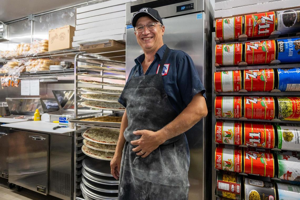 Pizza 51 owner Jason Pryor stands in the kitchen during the grand opening of Pizza 51’s newest location in Olathe on Wednesday, June 25.