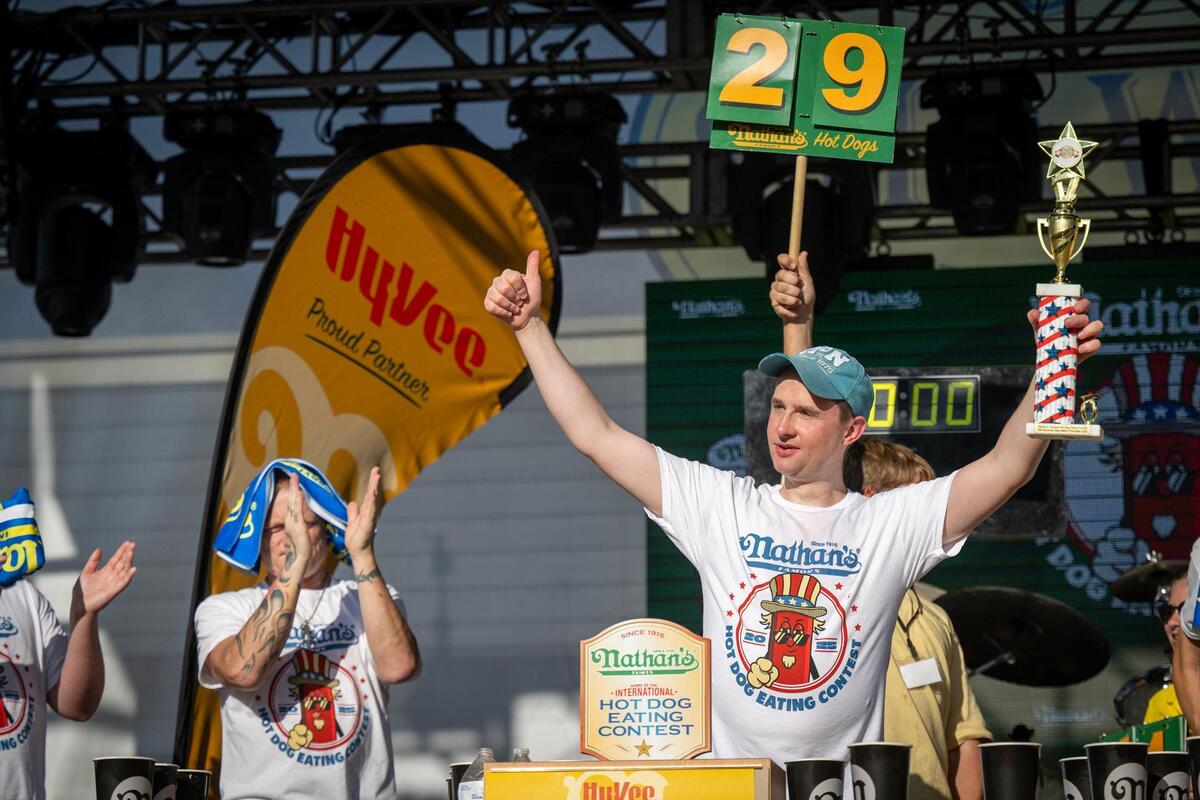 Radin Dvoracek of Ostrava, Czech Republic, held his trophy aloft after winning the men’s division of the Nathan’s Famous Hot Dog Eating Contest during Old Shawnee Days on Saturday, June 7, in Shawnee. Dvoracek ate 29 1/2 hot dogs in 10 minutes.