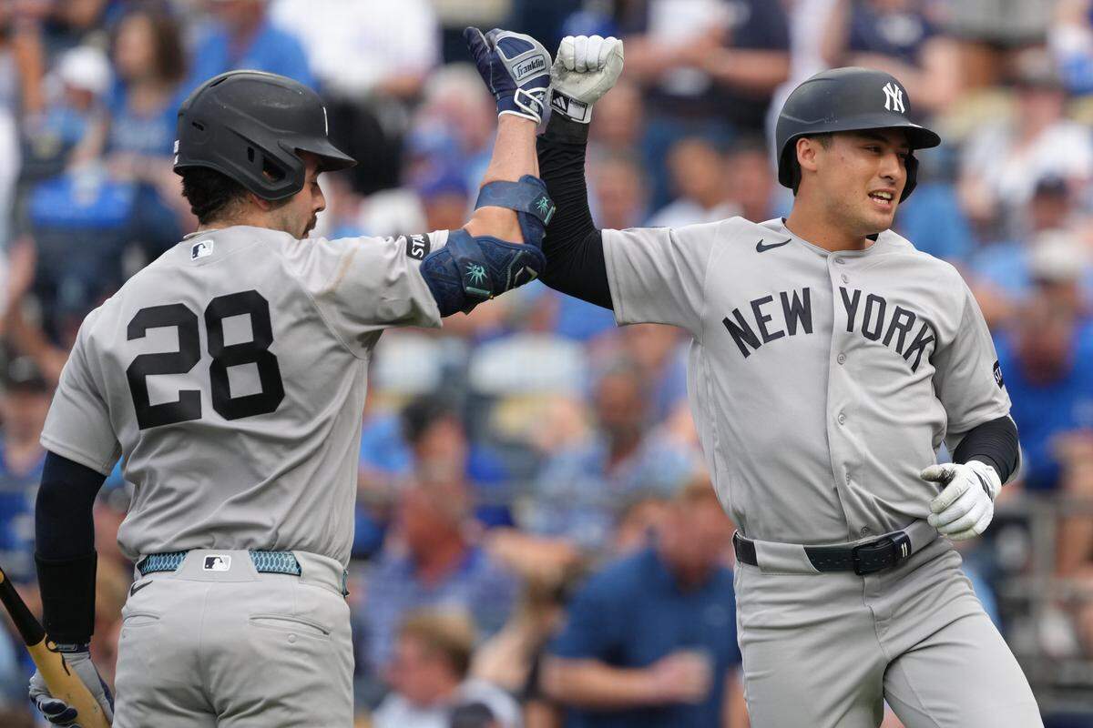 Anthony Volpe #11 of the New York Yankees celebrates his home run with Austin Wells #28 of the New York Yankees against the Kansas City Royals in the second inning at Kauffman Stadium on May 26, 2026 in Kansas City, Missouri.