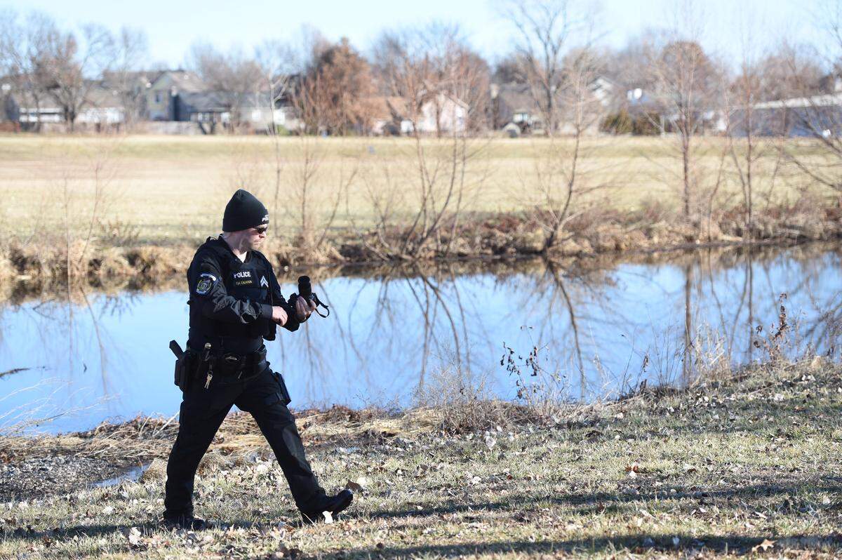 Greenwood police Cpl. Thomas Calhoun worked at the scene of a rescue, where he and the police chief helped save an infant. The child’s father allegedly tried to drown the infant in the pond and then turned himself in to police.