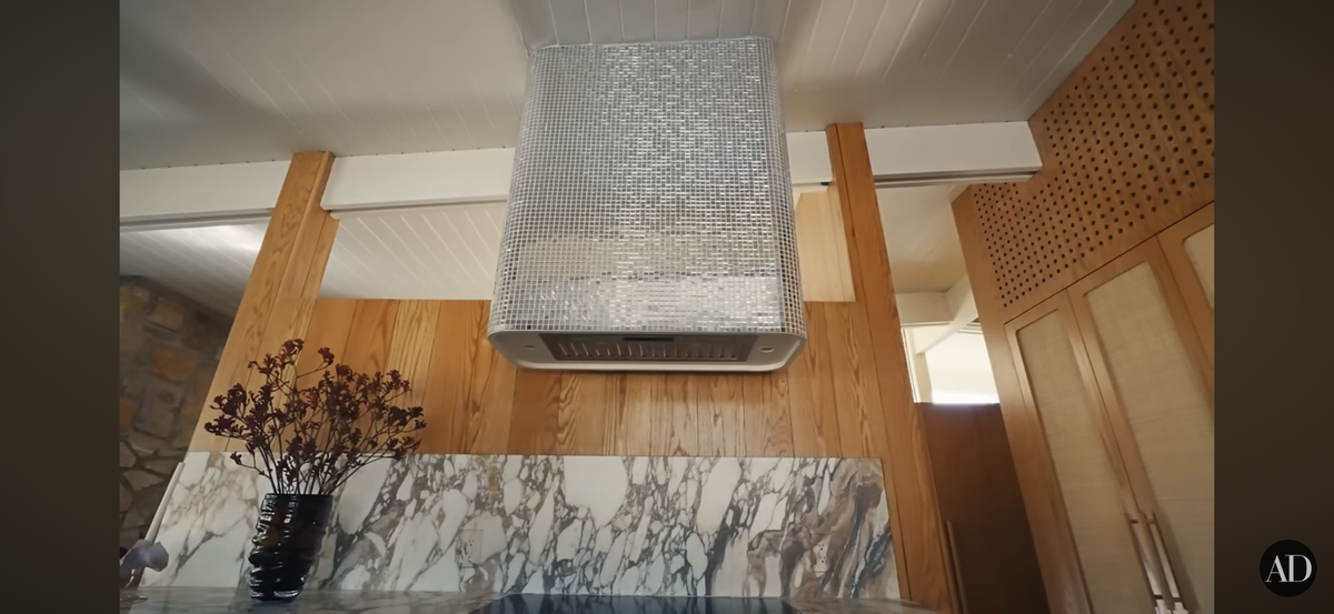 The disco ball range hood in Gardner’s kitchen. So Studo 54, she says.