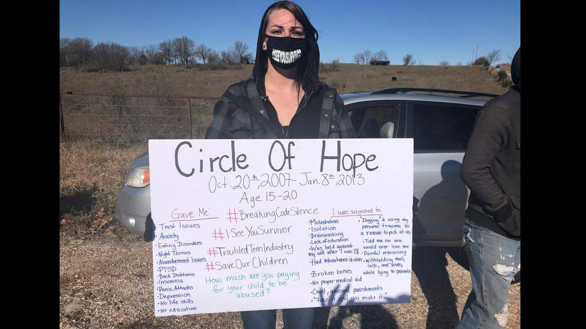 Maggie Drew attended a rally in November in Stockton, Missouri, to call attention to alleged abuses at Circle of Hope Girls Ranch and other faith-based reform schools. Her sign listed her own experiences, she said.