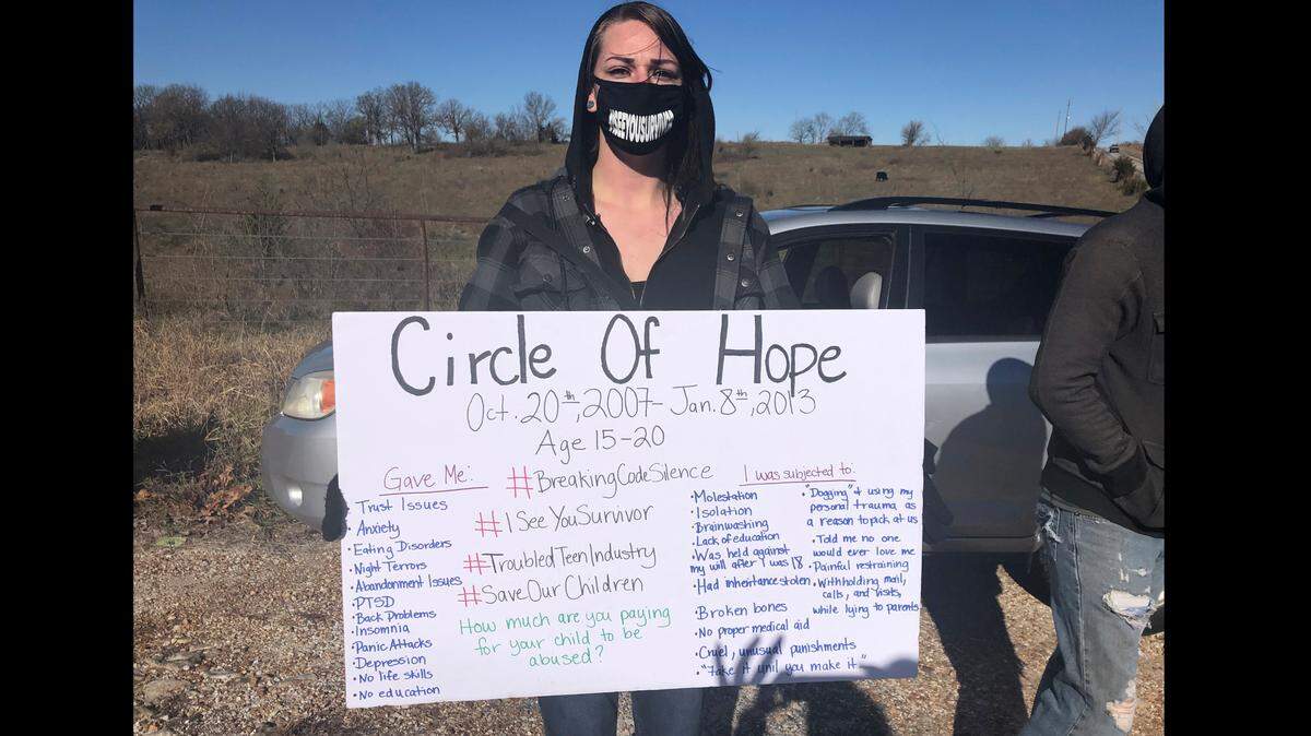 Maggie Drew attended a rally in November 2020 in Stockton, Missouri, to call attention to alleged abuses at Circle of Hope Girls Ranch and other faith-based reform schools. Her sign listed her own experiences, she said.