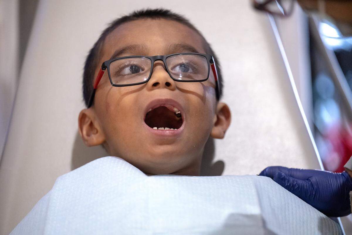 Austin Le, 6, of Kansas City was ready some free dental work done at the TeamSmile dental tailgate on Tuesday, Sept. 9, 2025 at GEHA Field at Arrowhead Stadium.  More than 200 volunteer dentists, hygienists, and dental assistants provide the care backed by TeamSmile and the Chiefs. 