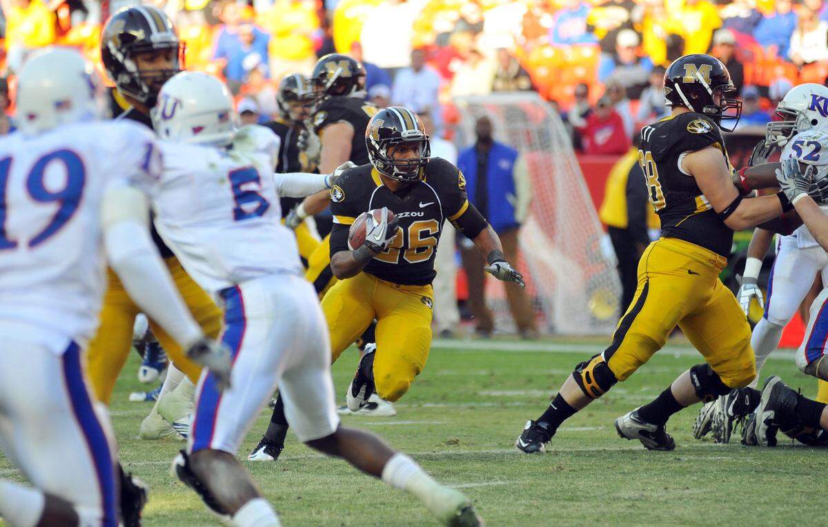 Missouri Tigers running back De'Vion Moore (26) runs in for a touchdown in the second half of the game against the Kansas Jayhawks at Arrowhead Stadium on Nov. 27, 2010.